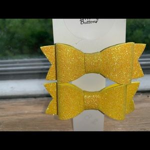 Pair of yellow hair bows